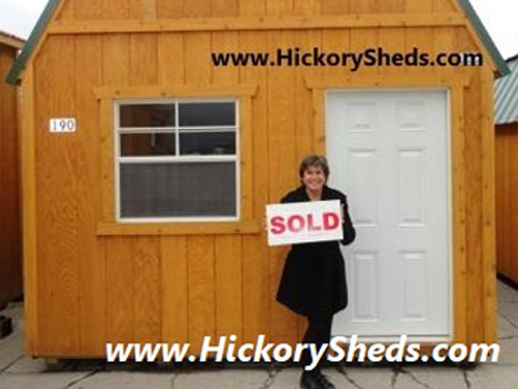 A woman happy with her new Hickory Shed