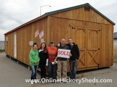 A family happy with their new Hickory Shed