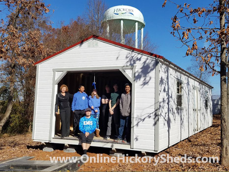 A family happy with their new Hickory Shed