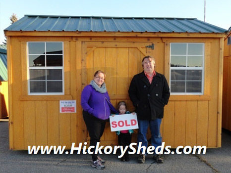 A family happy with their new Hickory Shed