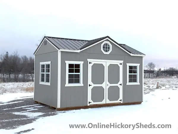 Gap gray Utility Shed with Gable Dormer in the snow