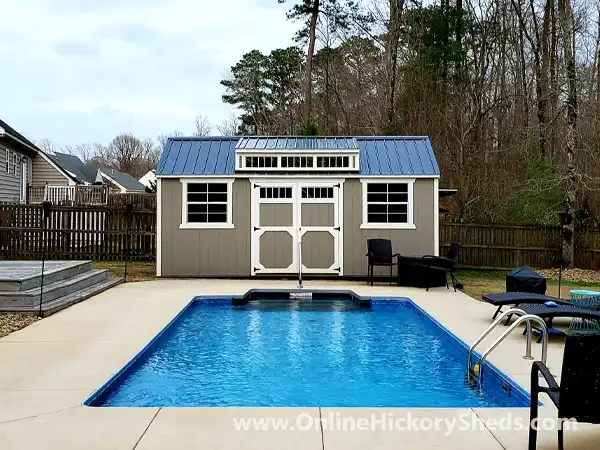 Old Hickory Utility Shed with a Dormer by the pool.