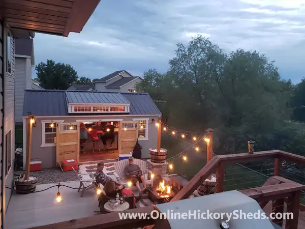 Utility Shed with a Dormer lit up with outdoor lights